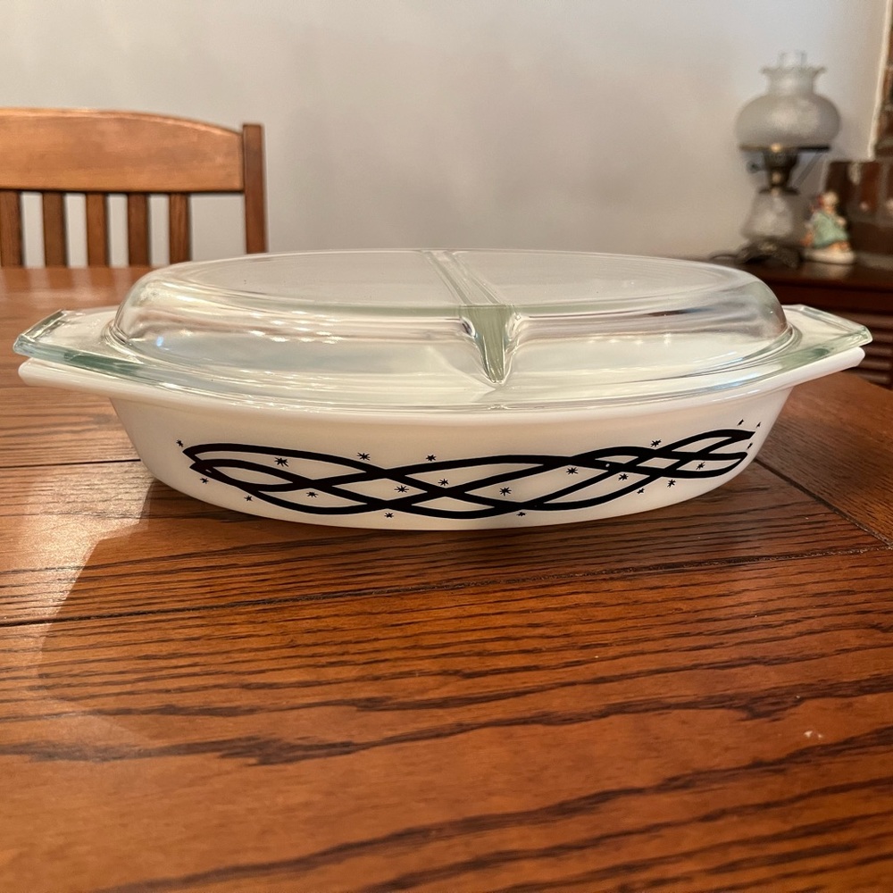 Vintage Pyrex white and black divided casserole serving bowl. In good shape.
